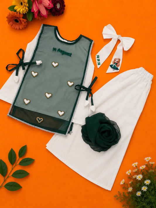 Girls white 3-piece 14 August dress set with green organza overlay, matching trousers and hair bow by Baby Bee Boutique